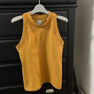 Athleta mustard colored sleeveless shirt.